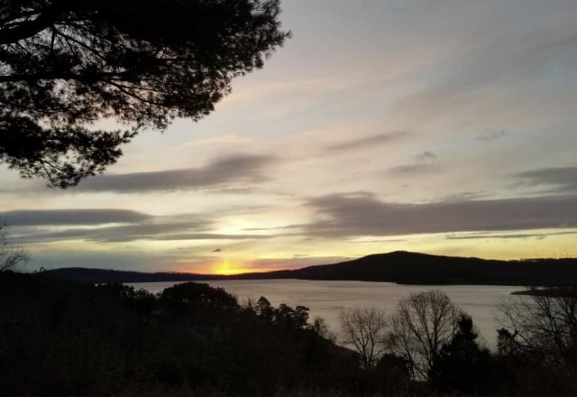 Photo of the sun setting over Round Valley Reservoir